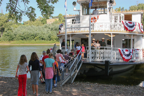 Students boarding a paddleboat. Students boarding a paddleboat.