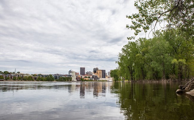 A color photo of the Mississippi River on a sunny day.