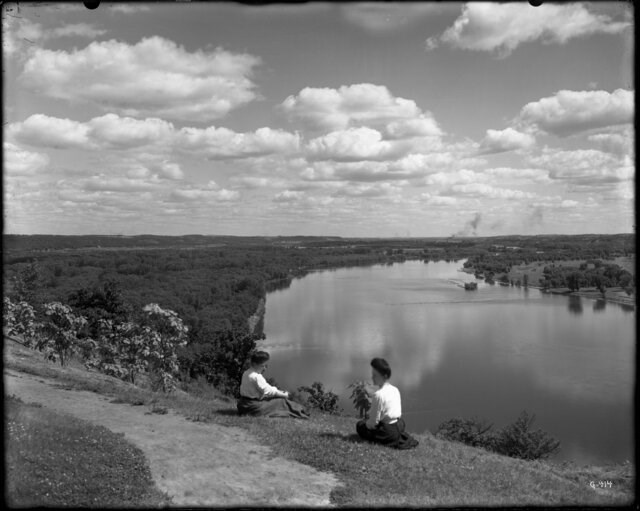 A black and white image of two women overlooking the Mississippi River.