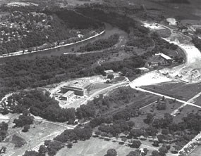 An aerial black and white photograph of the Bureau of Mines with the river in the background. An aerial black and white photograph of the Bureau of Mines with the river in the background.