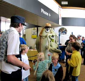 Freddie the Flathead Catfish, mascot of the Mississippi National River and Recreation Area, greets the crowd. Freddie the Flathead Catfish, mascot of the Mississippi National River and Recreation Area, greets the crowd.