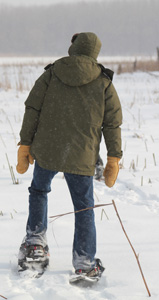 A snowshoer enjoying a snowy day in the Mississippi National River and Recreation Area. A snowshoer enjoying a snowy day in the Mississippi National River and Recreation Area.