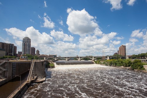 A river spills over a apron.