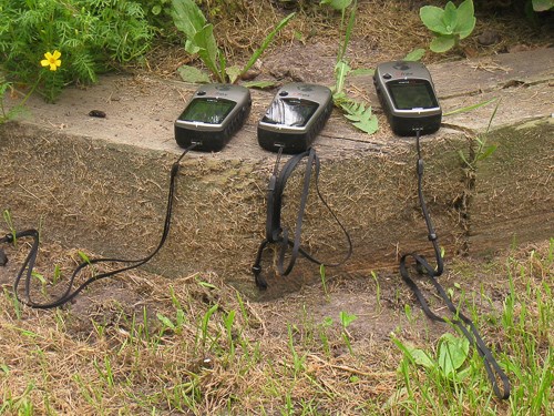 Three instruments sit on a wall.