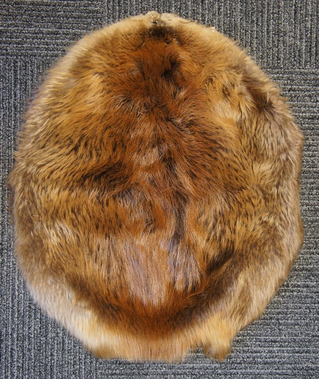 Beaver Pelt is circular and full of brown and tanish hues.