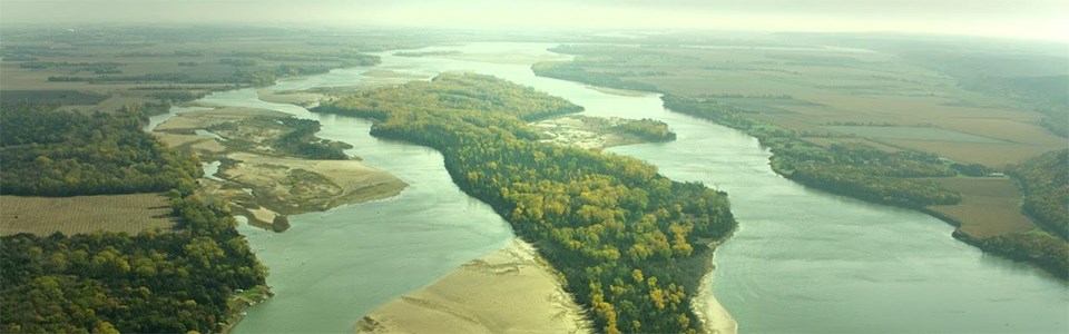Aerial view over the Missouri River and Goat Island in early autumn.