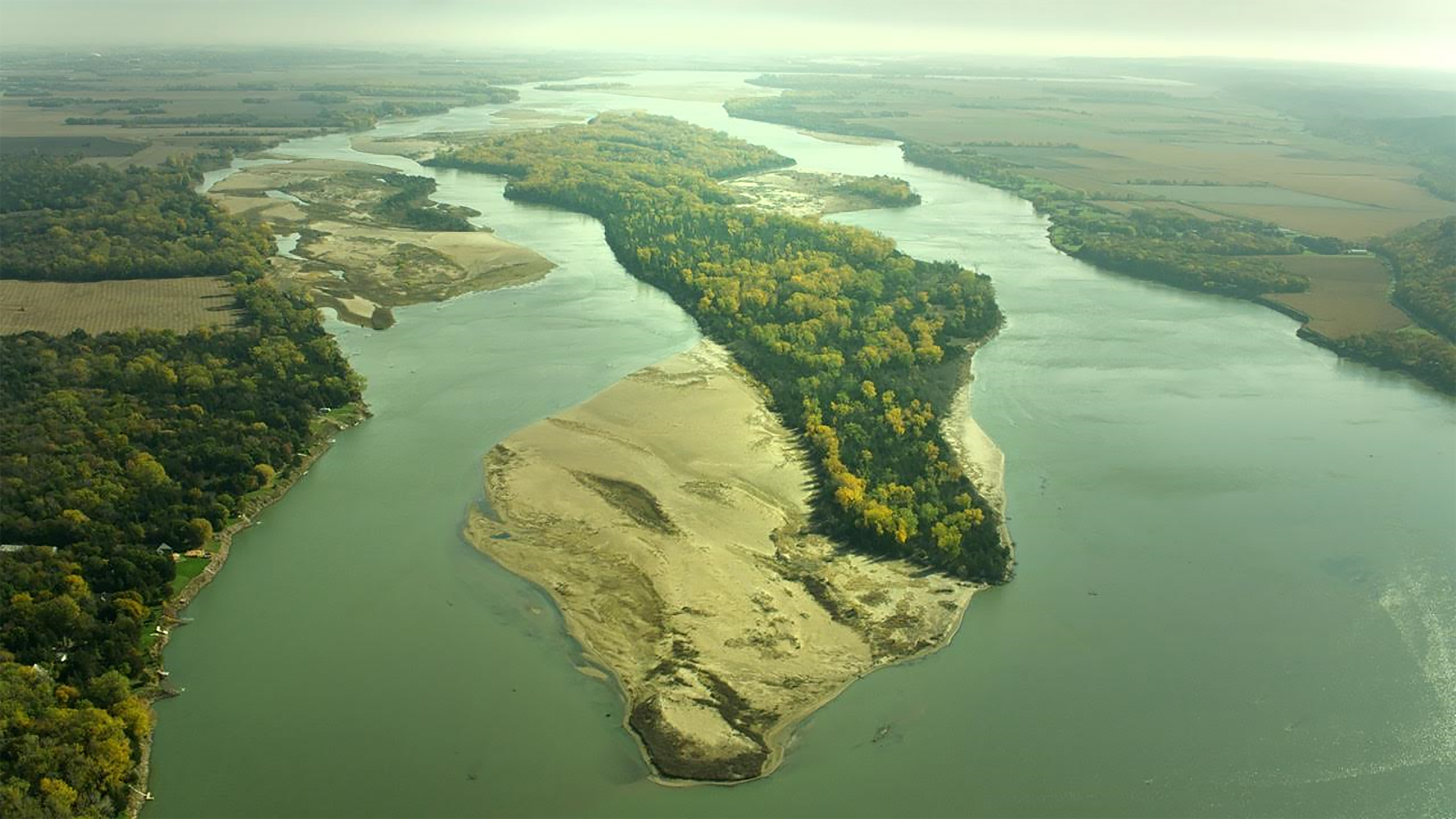 Aerial view over the Missouri River and Goat Island in early autumn.