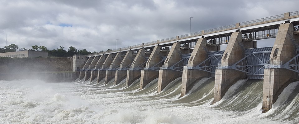 Large volumes of water flow out the gates of the Gavins Point Dam.
