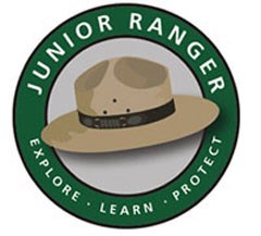 A ranger's hat surrounded by the words "Junior Ranger Explore Learn Protect"