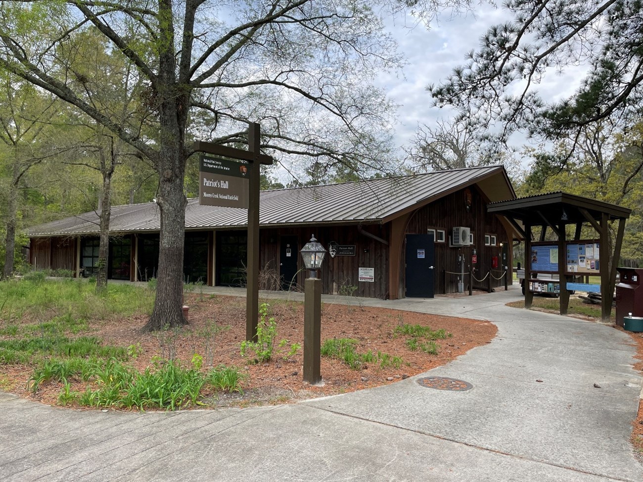 Patriots Hall Building with an interpretive kiosk next to it.