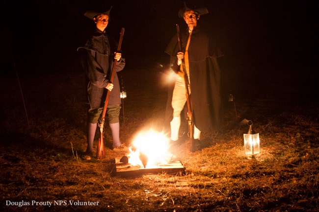 Patriots standing by fire