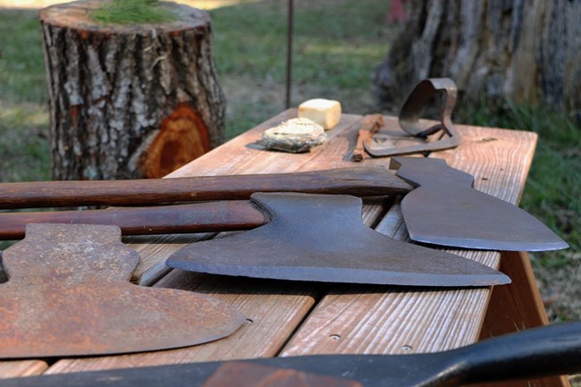 Woodworking tools are displayed during a living history event