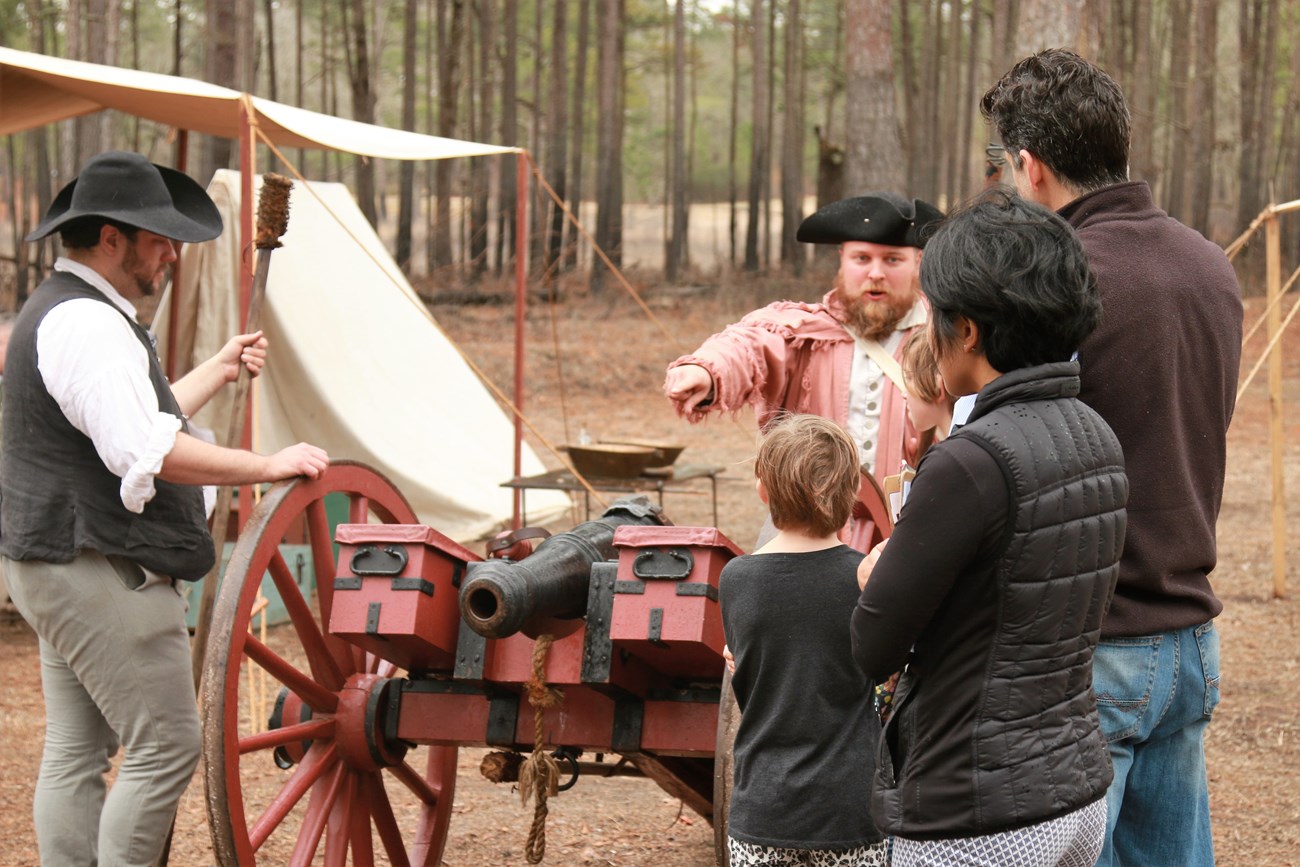 Volunteers talking with Visitors
