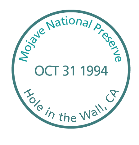 Round Passport Stamp Mojave National Preserve, Hole in the Wall, CA OCT 31 1994
