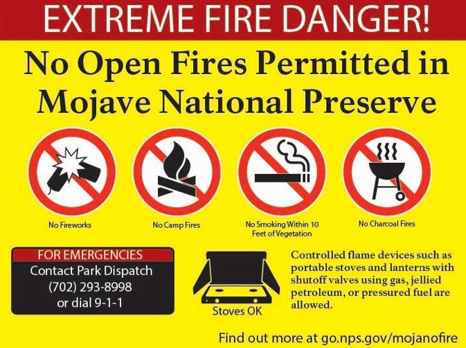 A picture of a sign that says Extreme Fire Danger No fires including campfires, charcoal grills, smoking within 10 feet of vegetation and as always fireworks are prohibited within the preserve.