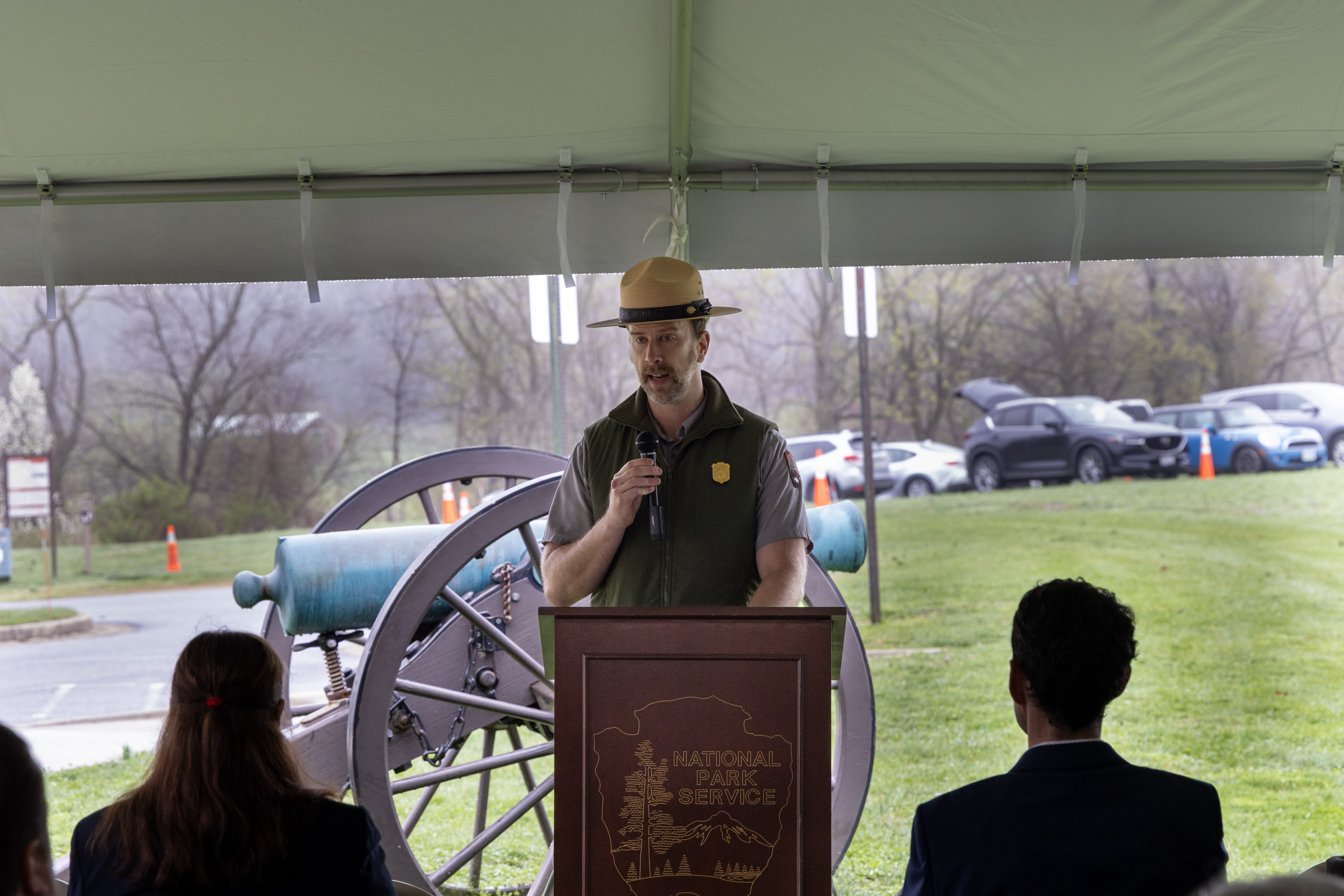 Park superintendent standing behind a podium and speaking to a crowd.
