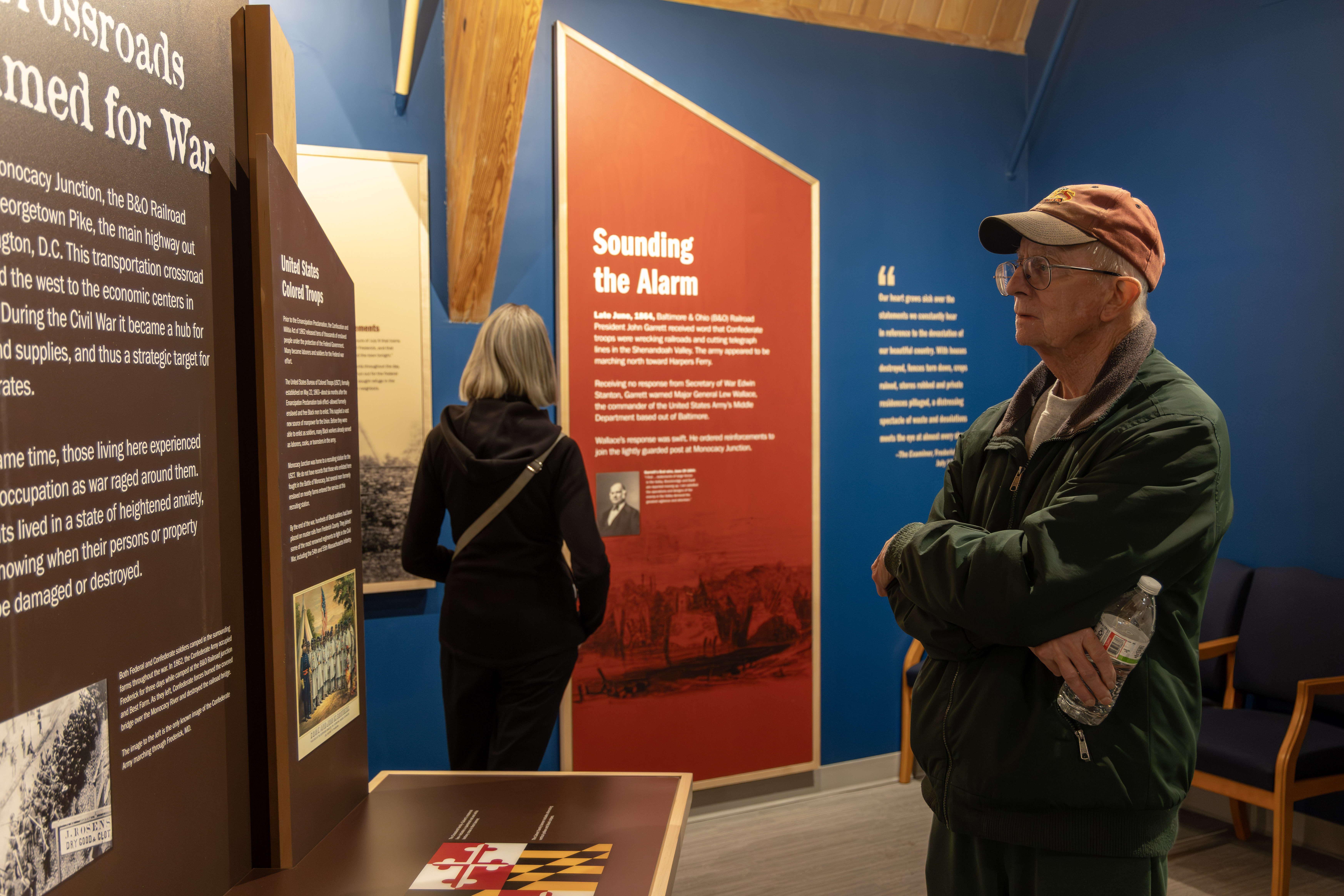 A visitor reads an exhibit panel in the Monocacy National Battlefield museum.