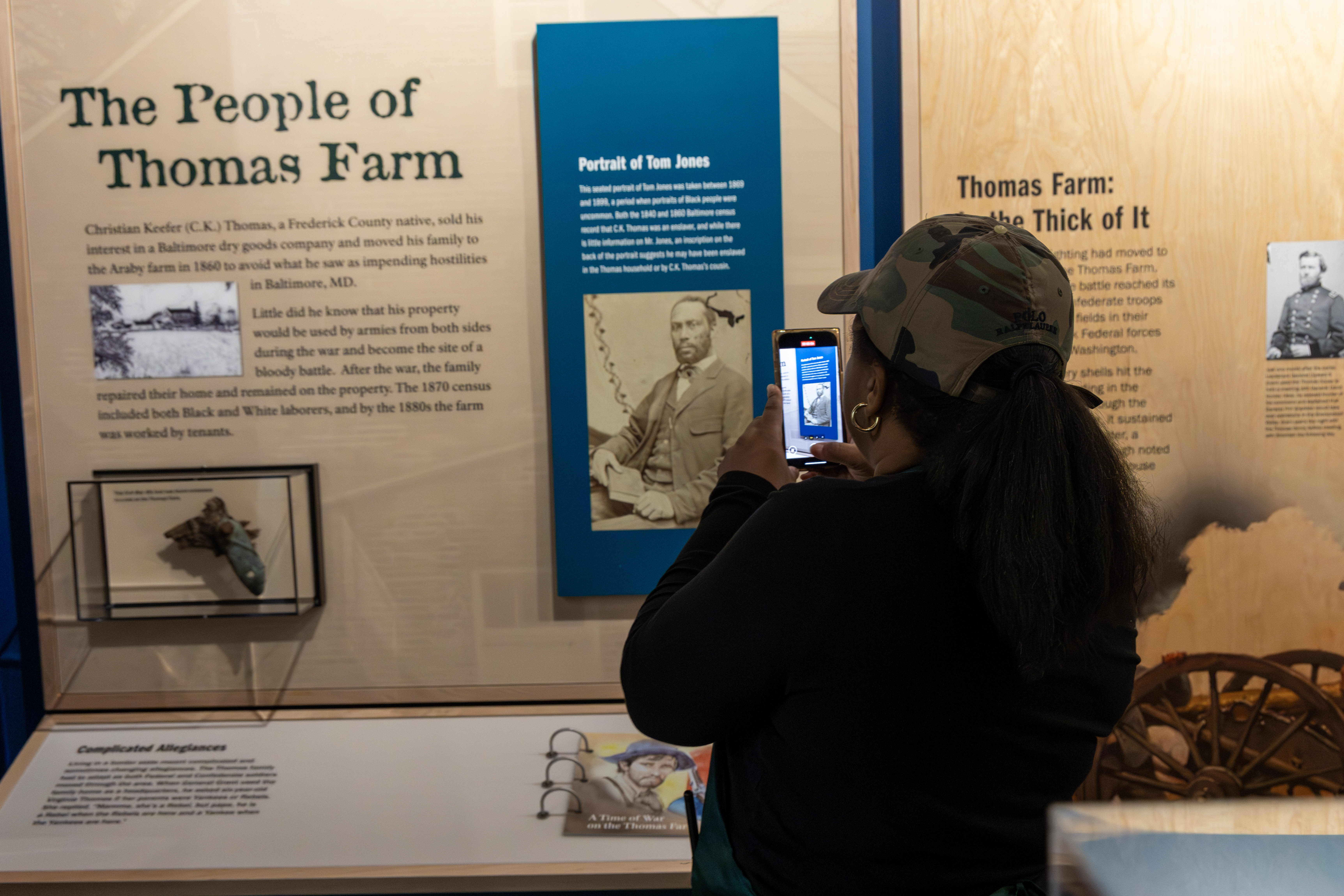 A visitor takes a photo of an exhibit at the Monocacy National Battlefield Museum.