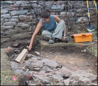 A Monocacy archeologist excavates an EU at the Best Farm. A Monocacy archeologist excavates an EU at the Best Farm.