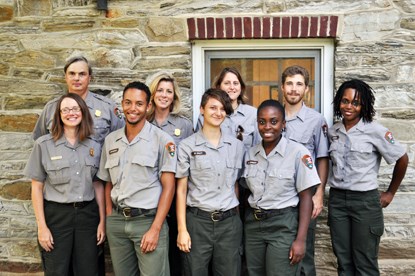 Nine people in Park Service uniforms