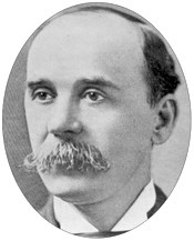 A middle-aged man with a mustache.
