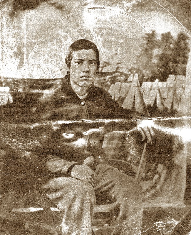 Black and white photo of young, white man in Union military uniform