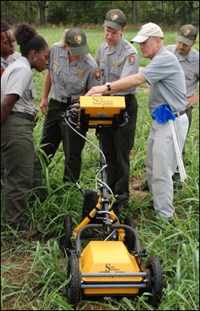 Archeologist use ground penetrating radar equipment