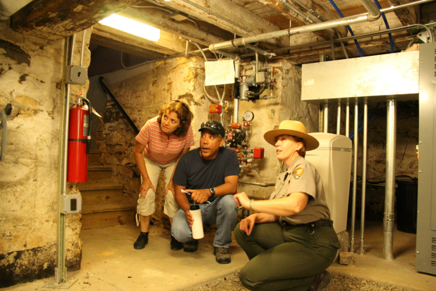 Park Ranger conducting a tour of the Thomas House cellar.