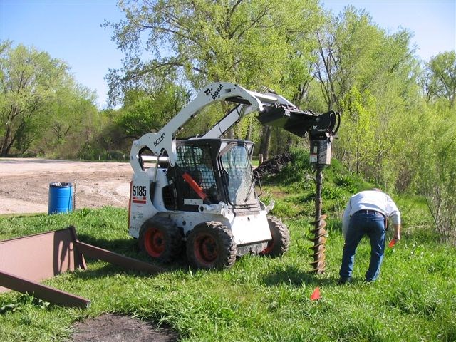 Dig_Camera_026.jpg Nebraska Mormon Trail Association volunteers installing and interpretive exhibit.