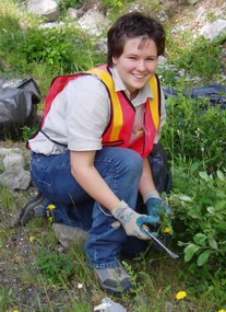 A volunteer helps with exotic plant removal A volunteer helps with exotic plant removal