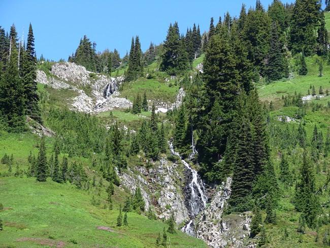 Waterfall cascading down into valley