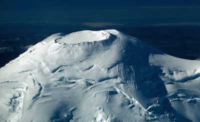 The summit crater of Mount Rainier as seen from above.