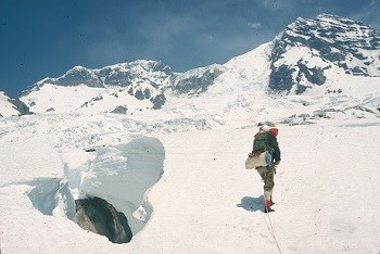 A mountain climber on a rope climbing the Tahoma glacier on the West side of the mountain.