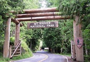 A log archway and sign greet visitors at the Nisqually entrance.