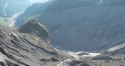 Rock and sediment moraine field left behind by the Nisqually glacier, with the Nisqually river carrying materials downstream. Rock and sediment moraine field left behind by the Nisqually glacier, with the Nisqually river carrying materials downstream.