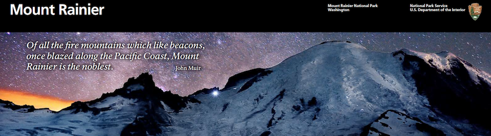 A portion of a brochure showing the top cover image of a glaciated mountain against a night sky. A black bar above has the text "Mount Rainier" on the left with a quote by John Muir below.