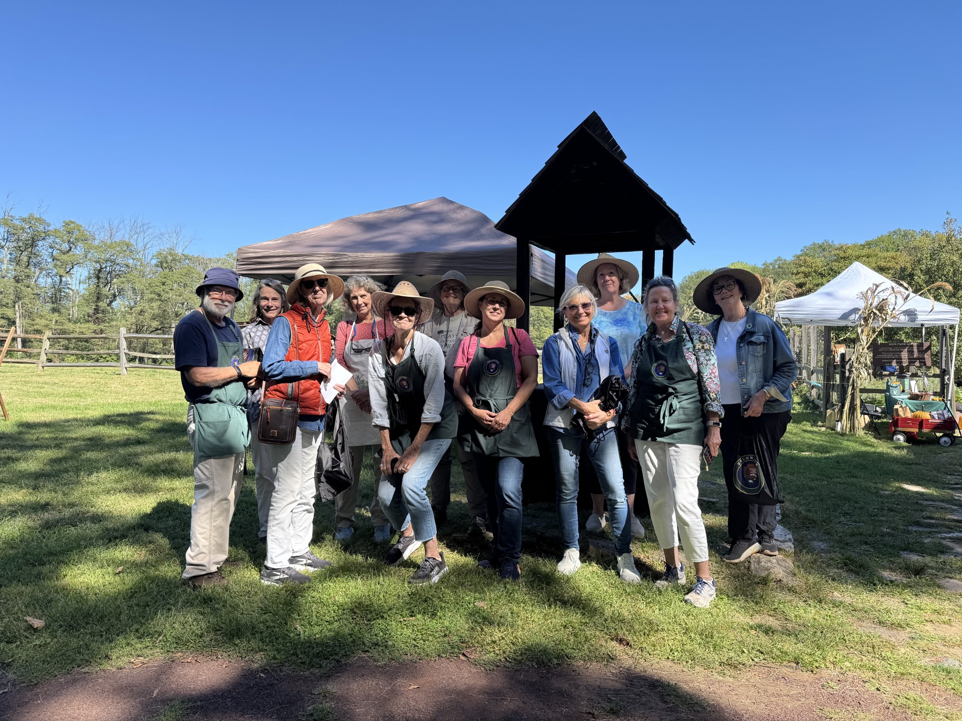 Volunteers from the Herb Society of America - Northern New Jersey Unit stand in front of the Wick Garden in Jockey Hollow.