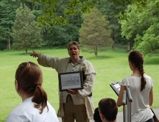 TRT Steve Santucci showing the Archival Ambassadors the layout of the camp at Joceky Hollow