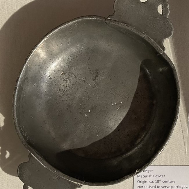 A porringer (bowl) made of pewter, viewed from above.