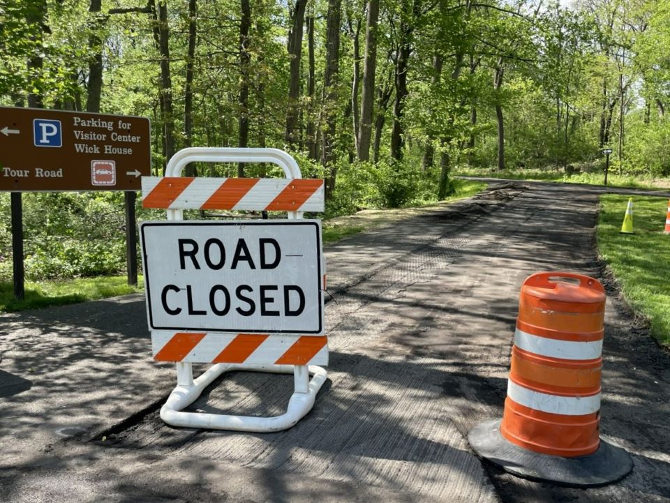 Road Closed sign in front of road to be repaved.