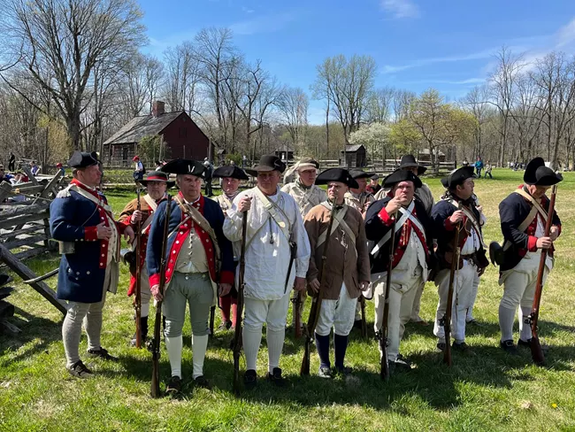 Reenactors in Continental Army uniforms at the Jockey Hollow encampment Reenactors in Continental Army uniforms at the Jockey Hollow encampment