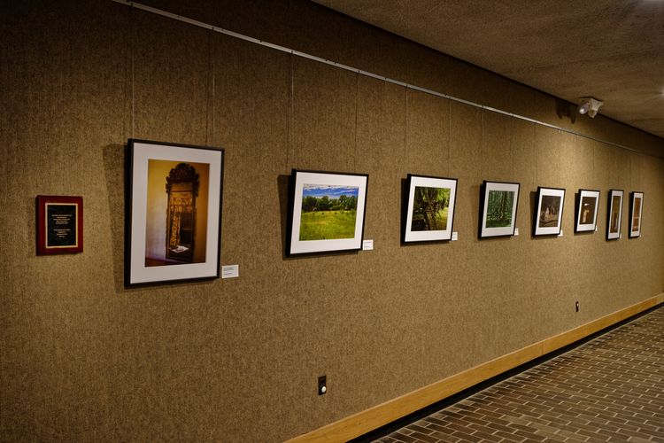 Visitor Center Photography Exhibit Photographs lined up on the wall inside the Jockey Hollow Visitor Center.