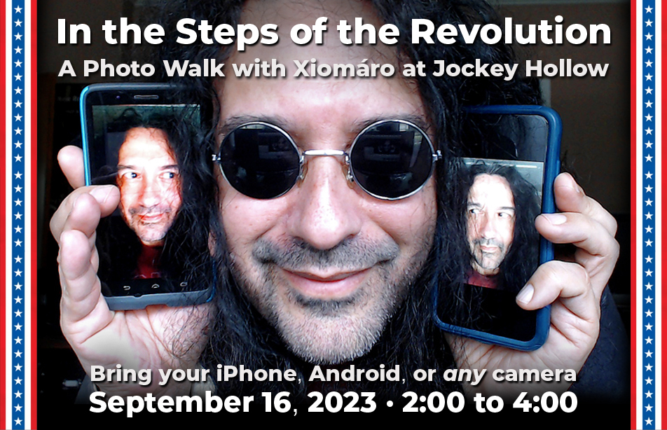 Xiomara holding two camaras. Photographer Xiomara holds two cameras on either side of his face. Both cameras also have a picture of his face. It lookls like the faces on the camera are looking at Xiomara in the center.