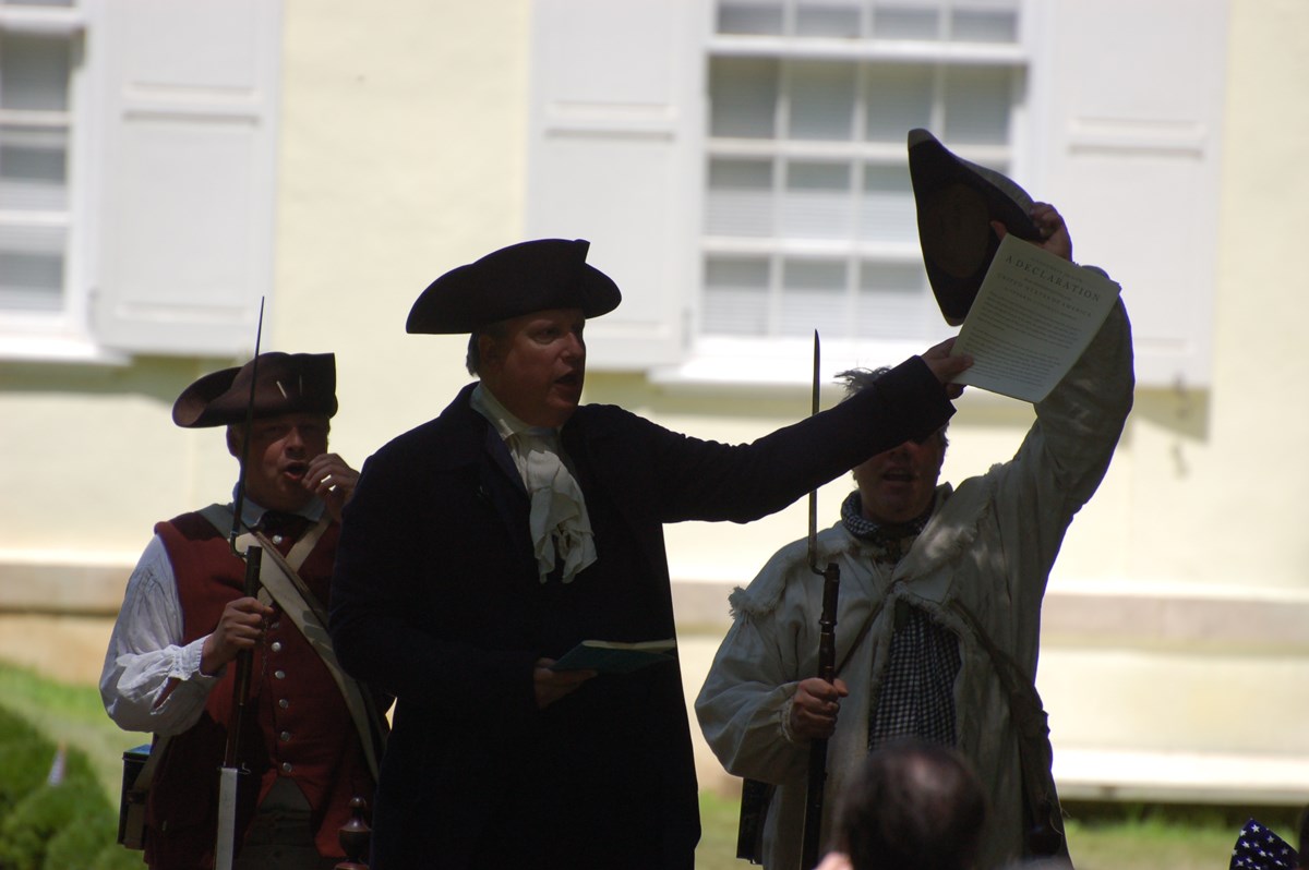 Costumed interpreter reading the Declaration of Independence