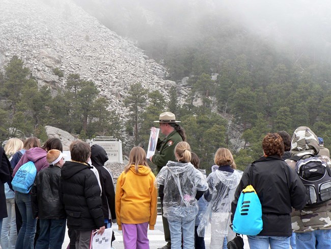 Park ranger with students at Mount Rushmore. Park ranger with students at Mount Rushmore.