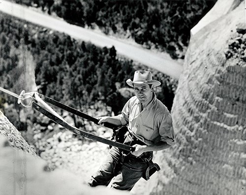Lincoln Borglum in a bosun chair on the side of Mount Rushmore. Lincoln Borglum in a bosun chair on the side of Mount Rushmore.