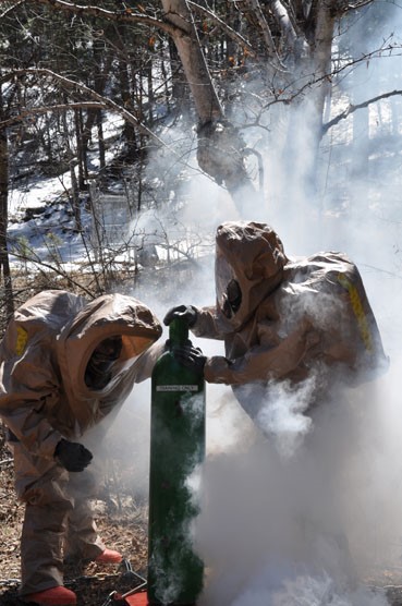 Staff Sergeants Alan Tuschen and Wayne Moser of the National Guard’s 82nd Civil Support Team work through a hazardous materials training exercise at Mount Rushmore National Memorial.