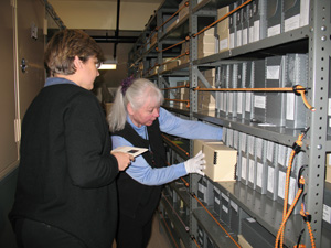 This image shows Sarah and Sue looking in film boxes