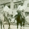 Trio on Horseback Near Watercourse 