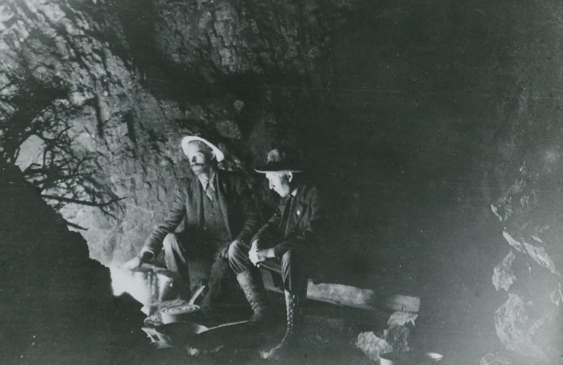 Chester Pinkham and unidentified man at camp